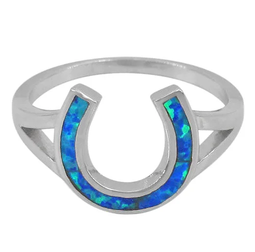 Sterling silver with rhodium, 11x12mm horseshoe ring with emulated opal stone.