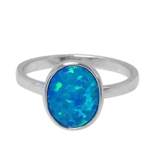 Sterling silver with rhodium, 11x9mm emulated opal stone ring.