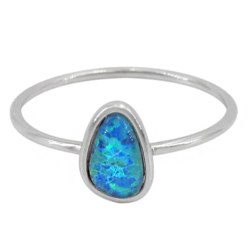 Sterling silver with rhodium, 6x9mm emulated opal stone ring with 1mm band.