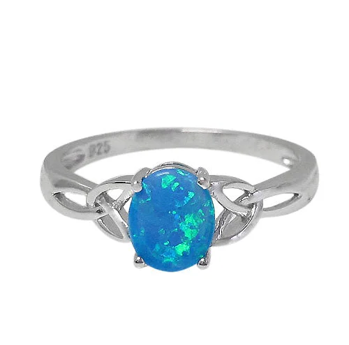 Sterling silver with rhodium, 8x7mm emulated opal stone ring with Celtic knot design.