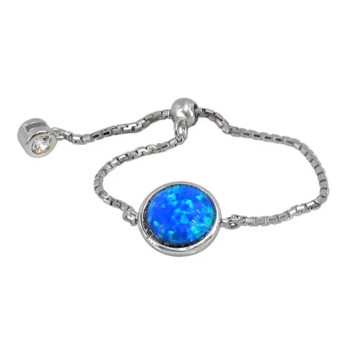 Sterling silver with rhodium plated, adjustable ring with 7mm emulated opal stone and 2mm cubic zirconia.